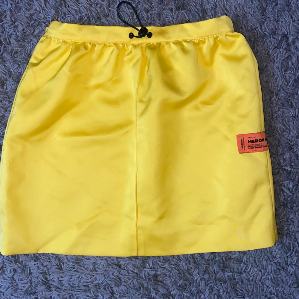 HERON PRESTON TECHNICAL SKIRT WITH ADJUSTABLE TAB